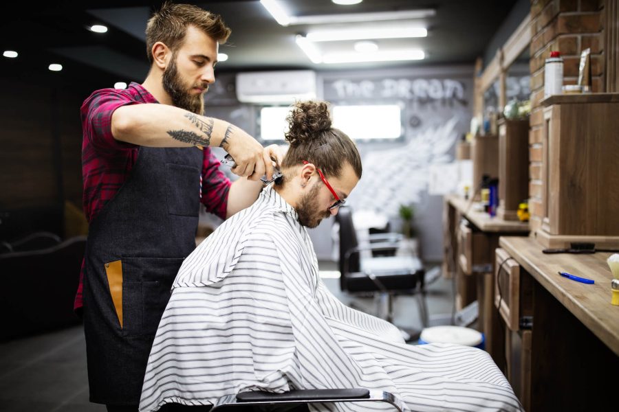 young-bearded-man-getting-haircut-by-hairdresser-w-2021-08-29-09-42-52-utc.jpg